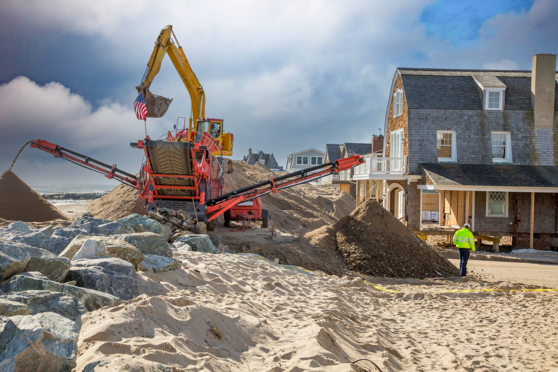 Crane Clearing out sand after disaster on beach