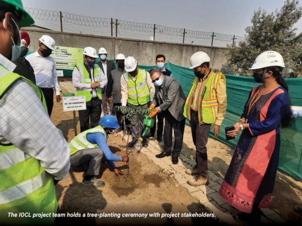 The IOCL project team holds a tree-planting ceremony with project stakeholders.