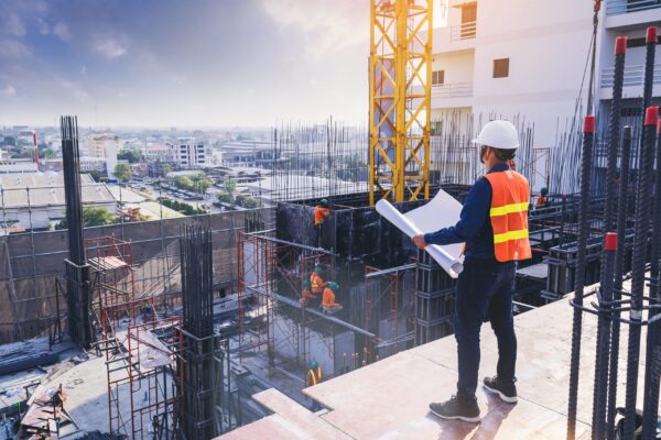 Smart,Civil,Architect,Engineer,Inspecting,And,Working,Outdoors,Building,Side