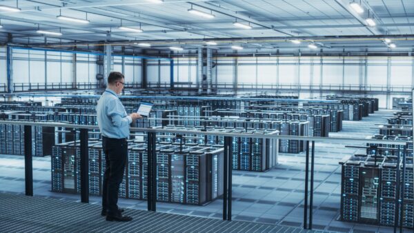 Data,Center,Engineer,Using,Laptop,Computer.,Server,Farm,Cloud,Computing