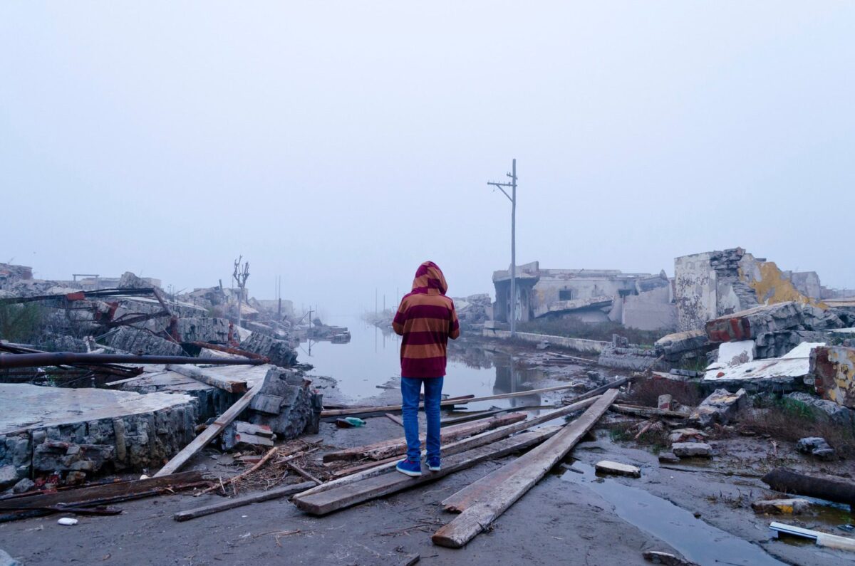 Boy,Watching,The,Flood,In,Epecuen,,Buenos,Aires,,Argentina.,Climate