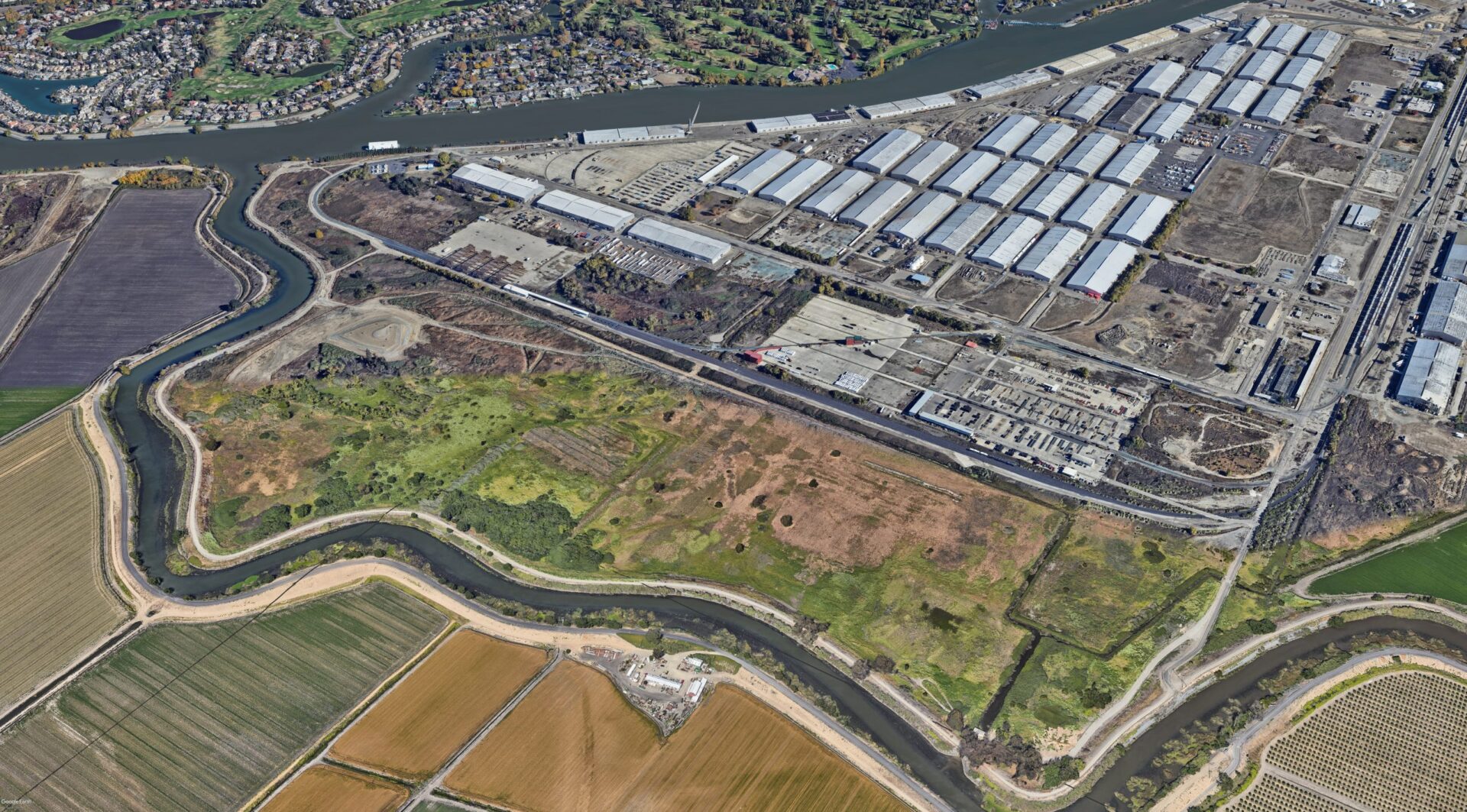 an aerial view of a river and a city
