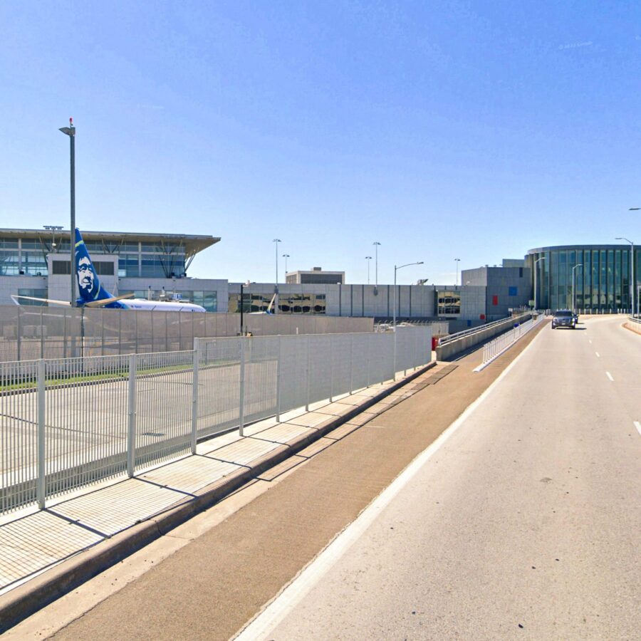 road to buildings on a sunny day