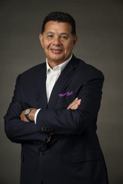 E 250812 CEO Raouf Ghali posing with his arms crossed, in a black suit.