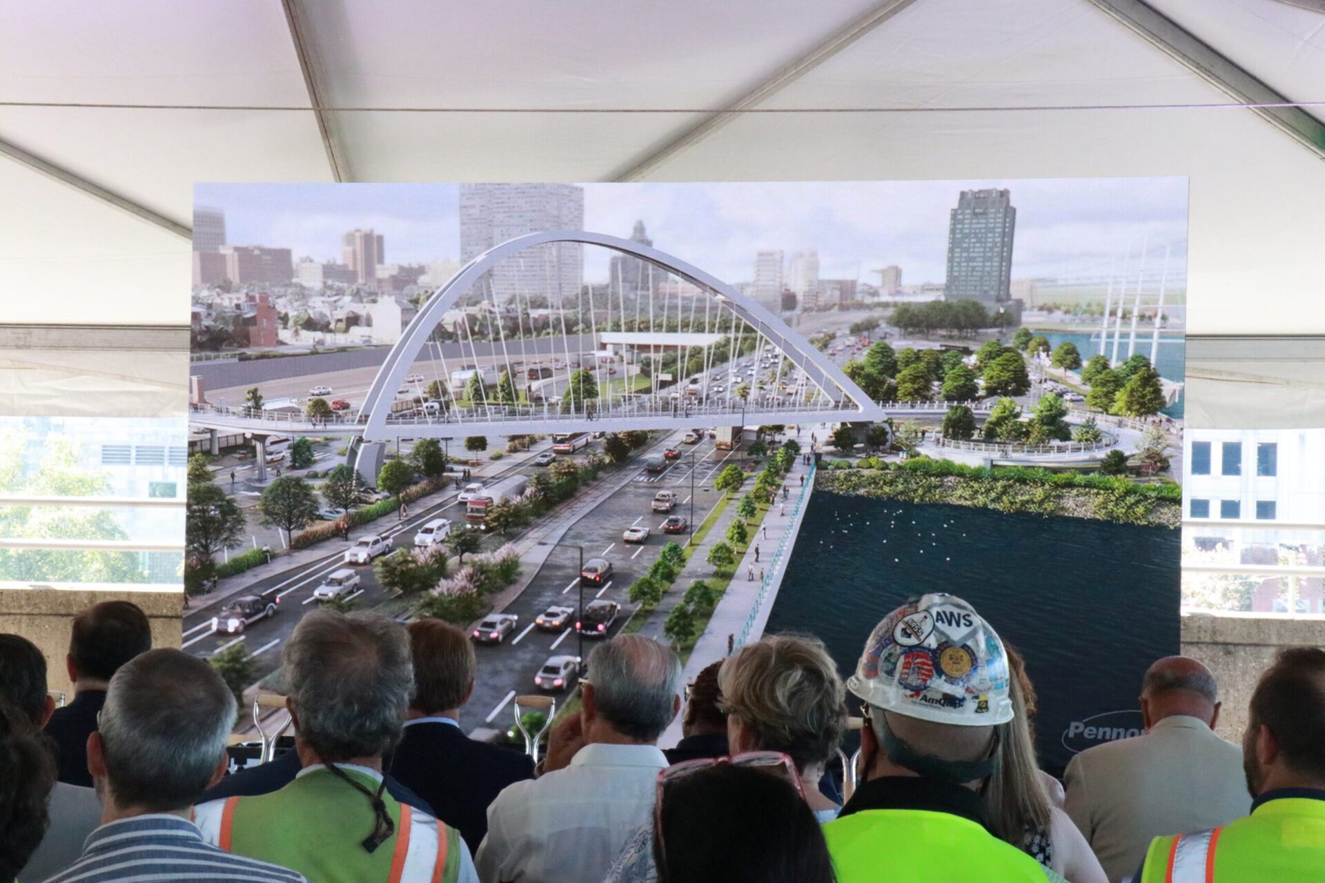 A group of construction experts reviewing a Rendering of the I-95 CAP bridge