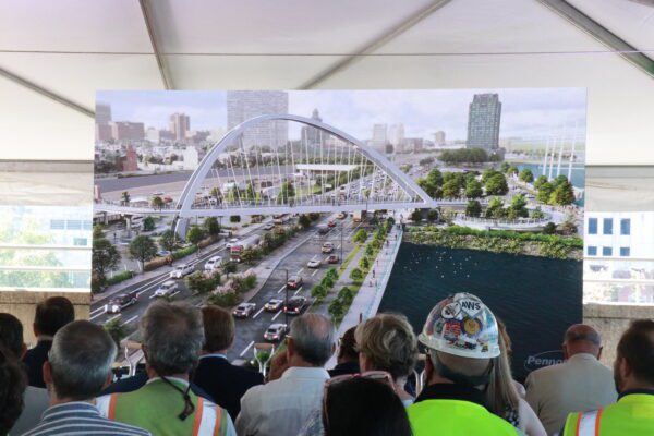I-95 CAP A group of construction experts reviewing a Rendering of the I-95 CAP bridge